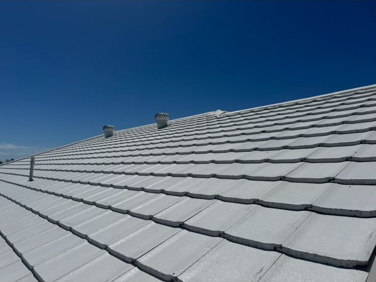 White concrete tiles on a re-roofed roof